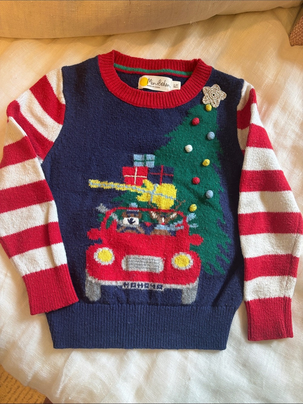 Mini Boden Navy Christmas Sweater with Red Striped Sleeves and Festive Car